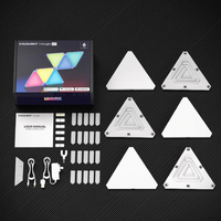 Cololight 6-piece smart triangle LED gaming lights on bedroom wall