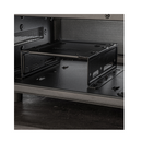 Black metal bracket or mount on a dark surface with a grid pattern in the background